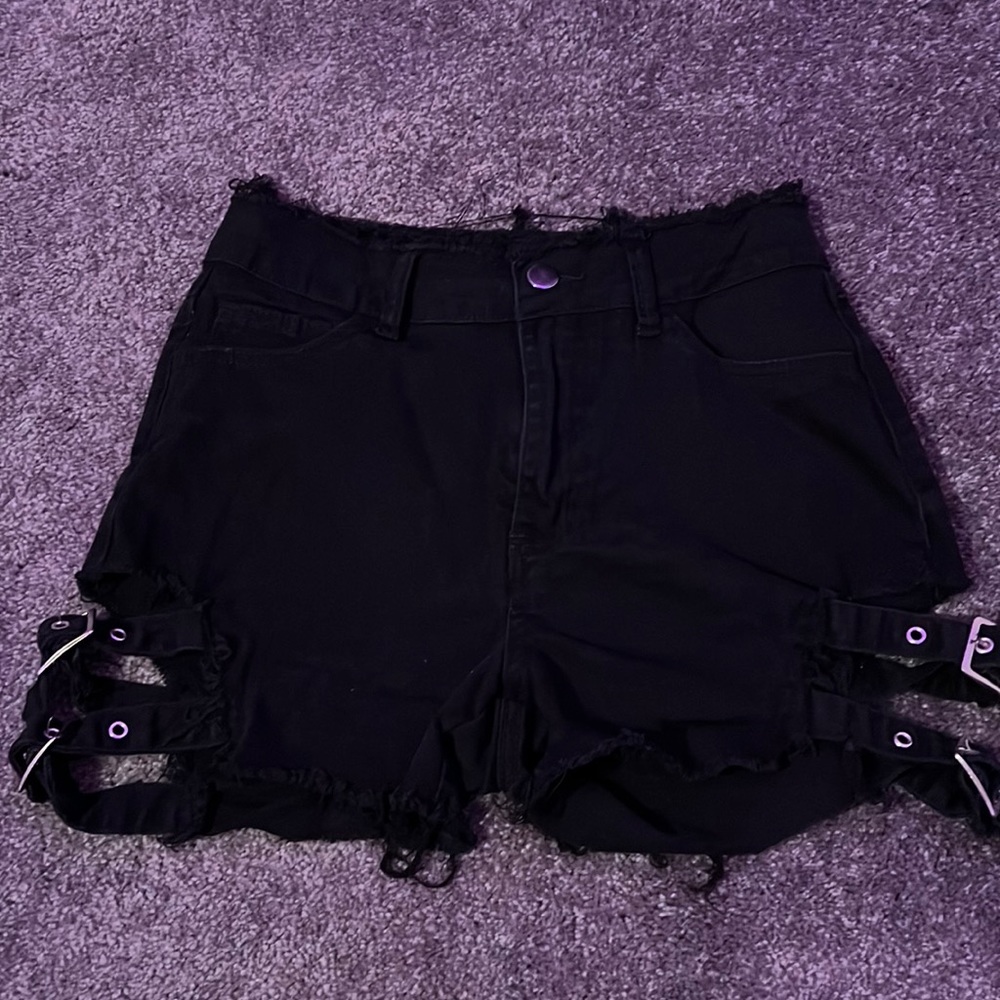 Hardly worn Jean shorts with adjustable buckles on the sides.